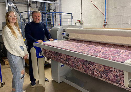 Jasmine Thomas and with David Wilson from 13 Amp with a Klieverik Vertex calender press