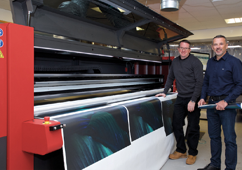 Managing Director, Seath Herbert and Production Director, Pete Yeo, at Artworks Solutions with a EFI VUTEk 32h super-wide UV LED hybrid printer.