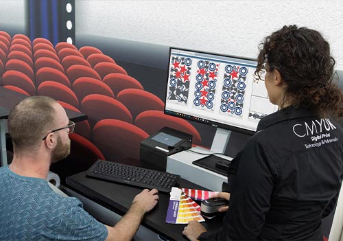 Amira Bouchiba, Manager of the CMYUK Academy training a customer on Fiery Prepit