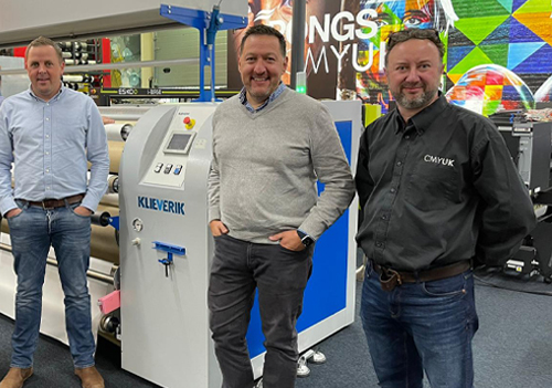 Lee Crew and Nick Lindwall from Ottimo Digital and Brett Platt from CMYUK at CMYUK with a Kleverik GTC 101 3500-calender press.