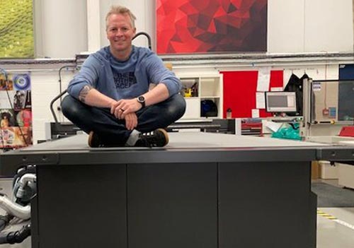Ryan Fairweather from Revolution Signs with a Kongsberg X24 Edge digital cutting table from CMYUK