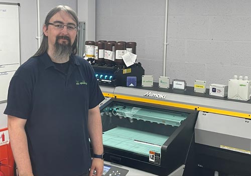 Shane McNally from Spelsberg UK with a Mimaki UJF-6042MkII e digital printer from CMYUK.